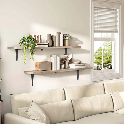 Living room with a beige sofa, wooden shelves, and a window with blinds.