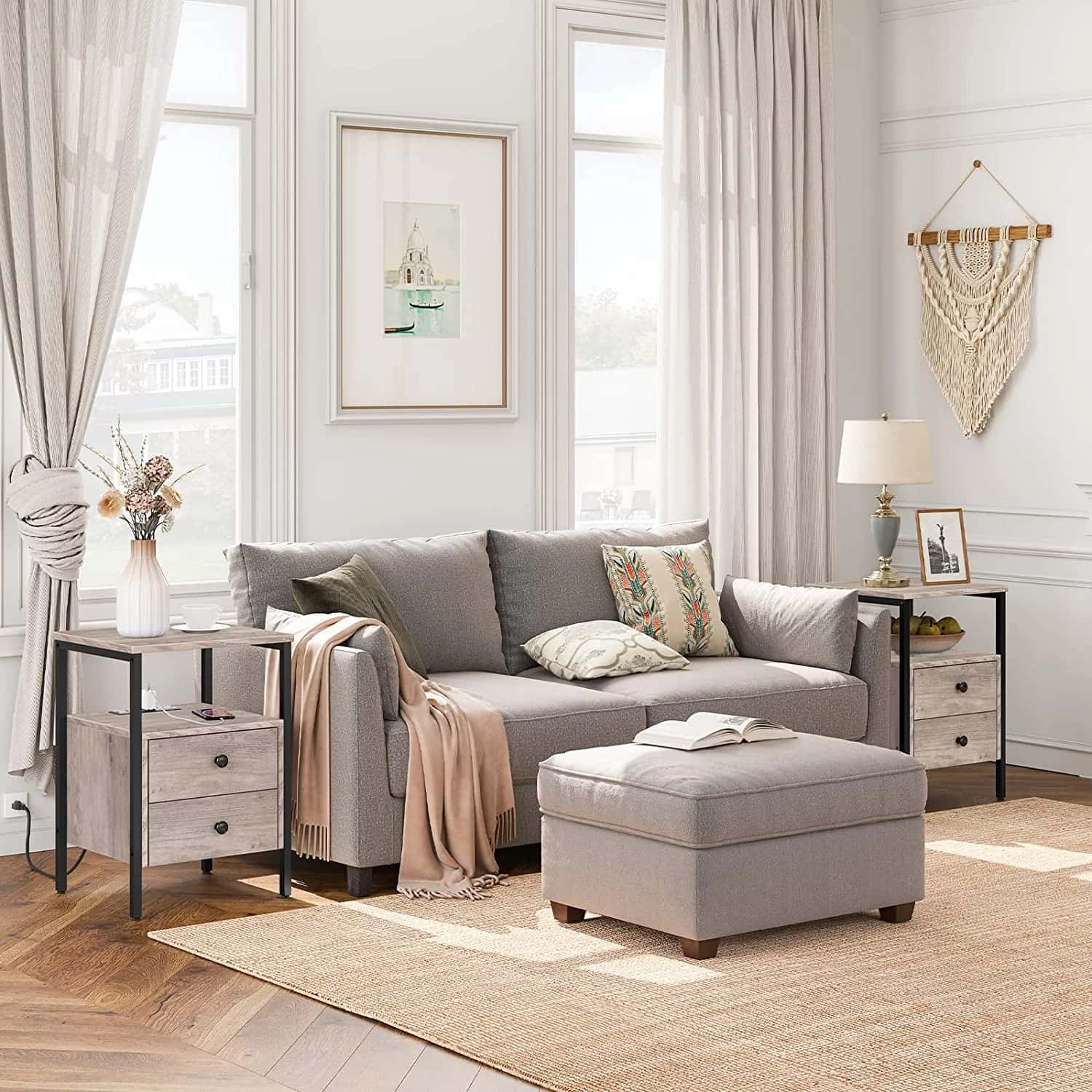 Living room with gray sofa, ottoman, and decorative items.