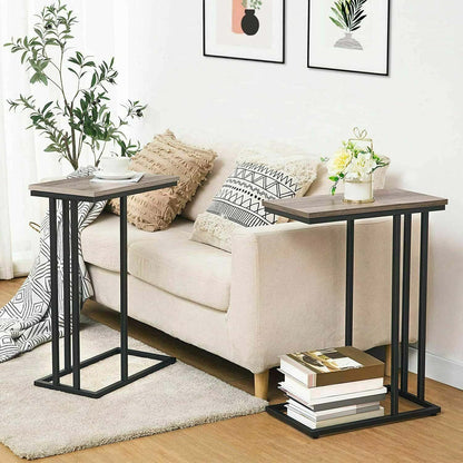 Two side tables in a living room setting with a sofa and decor items.