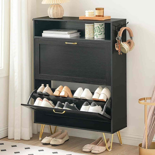 Black shoe cabinet with open door showing shoes, placed in a room with decor elements.