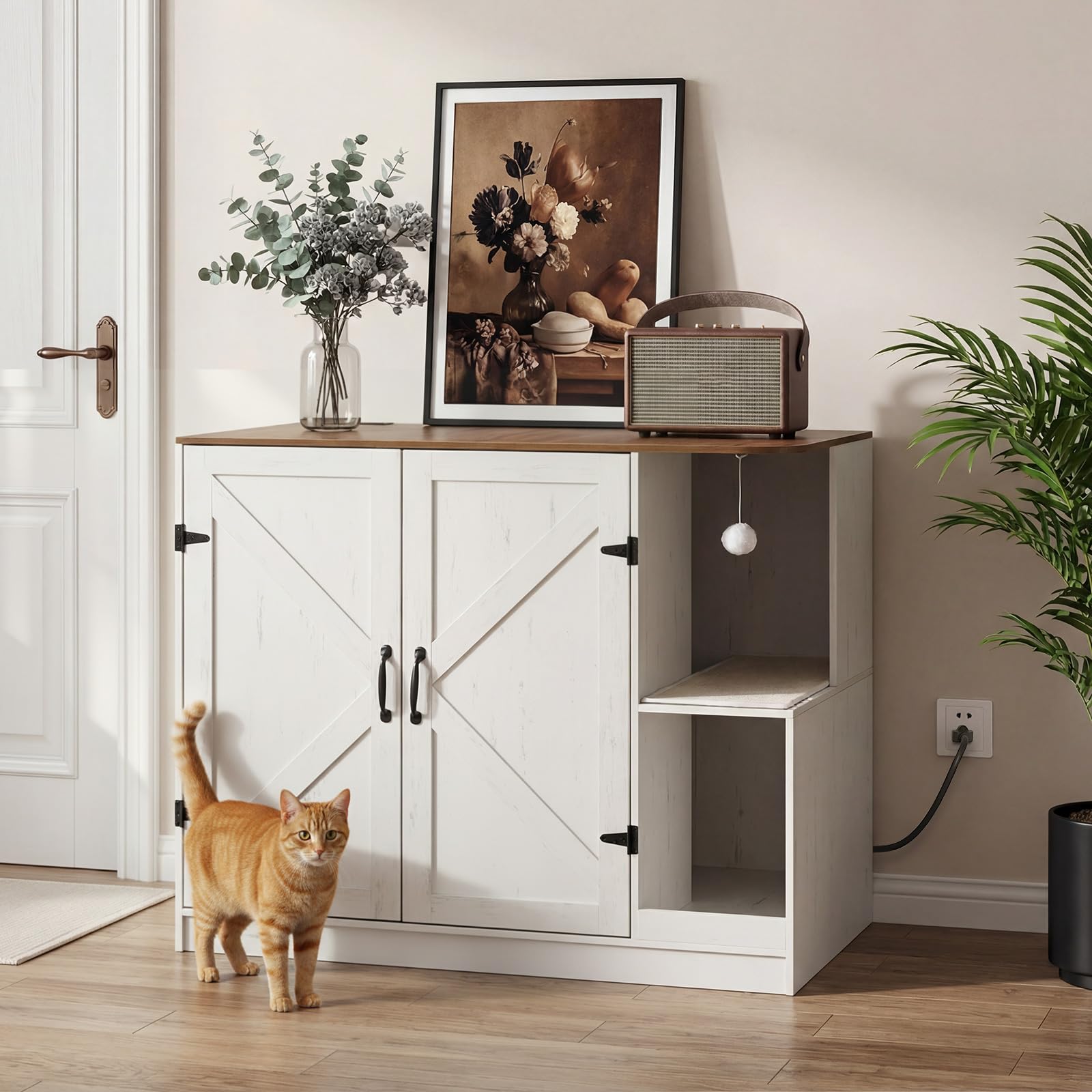 White cabinet with wooden top in a room with a cat, plant, and decorative items.