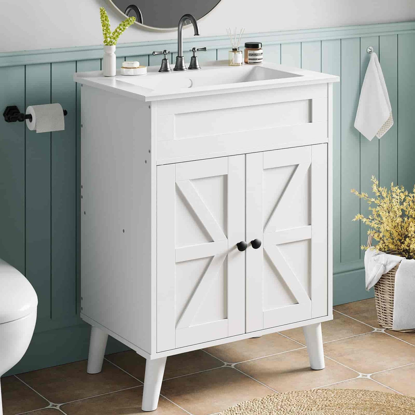 White bathroom vanity with sink against a teal wall