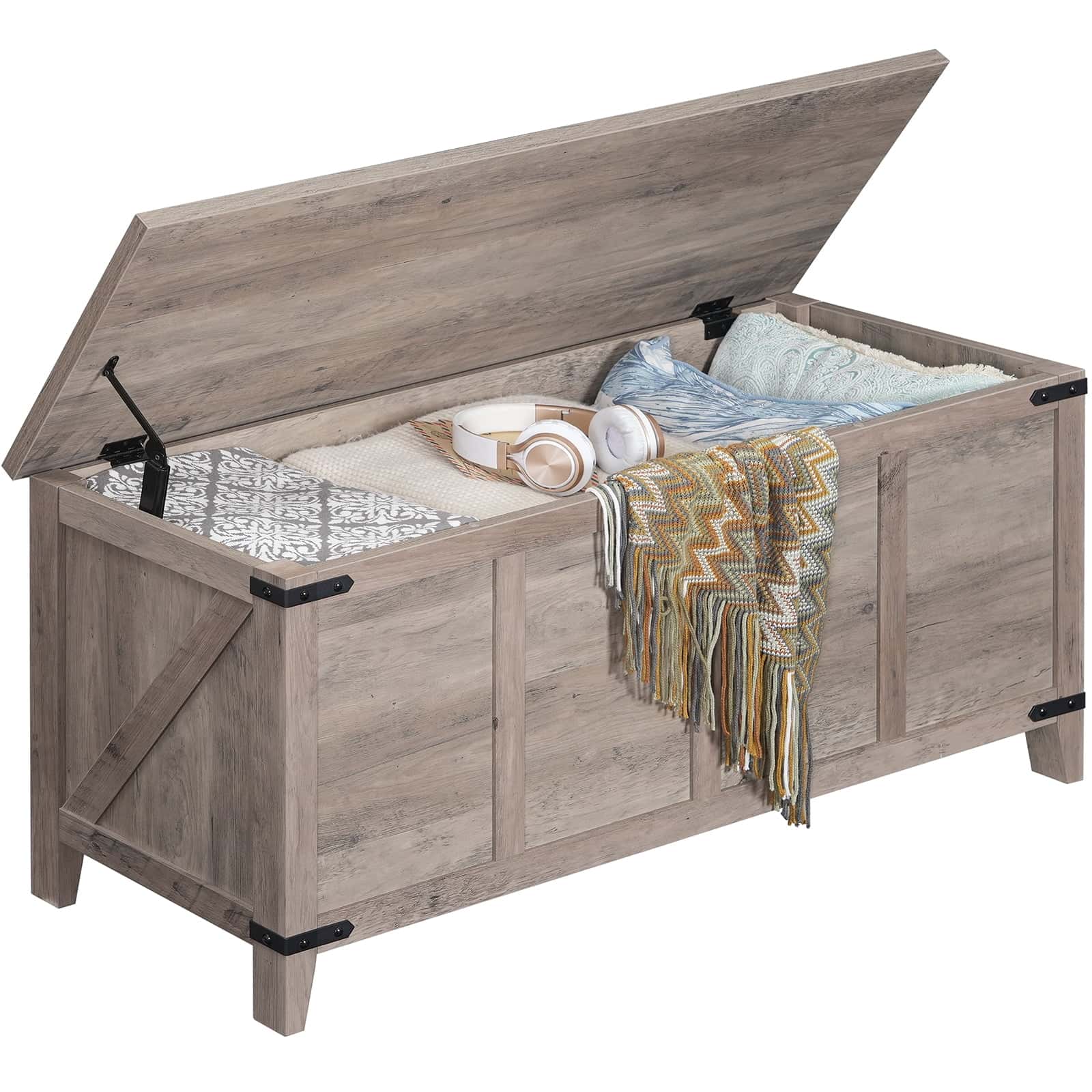 Wooden storage bench with open lid revealing blankets and items inside on a white background