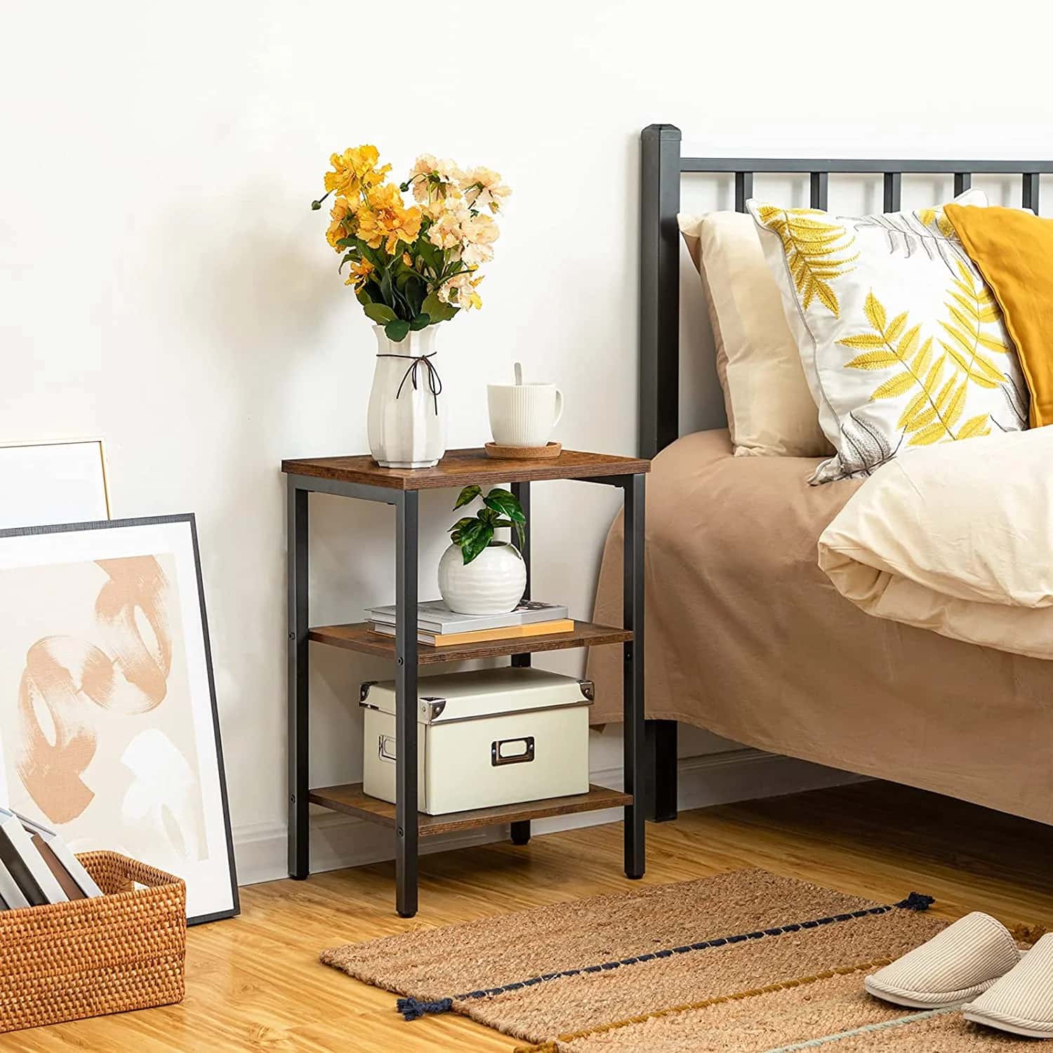 Bedroom with a nightstand, bed, and decorative items.