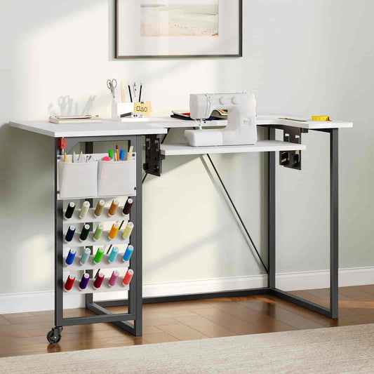 White sewing table with a rolling cart for supplies in a home setting.