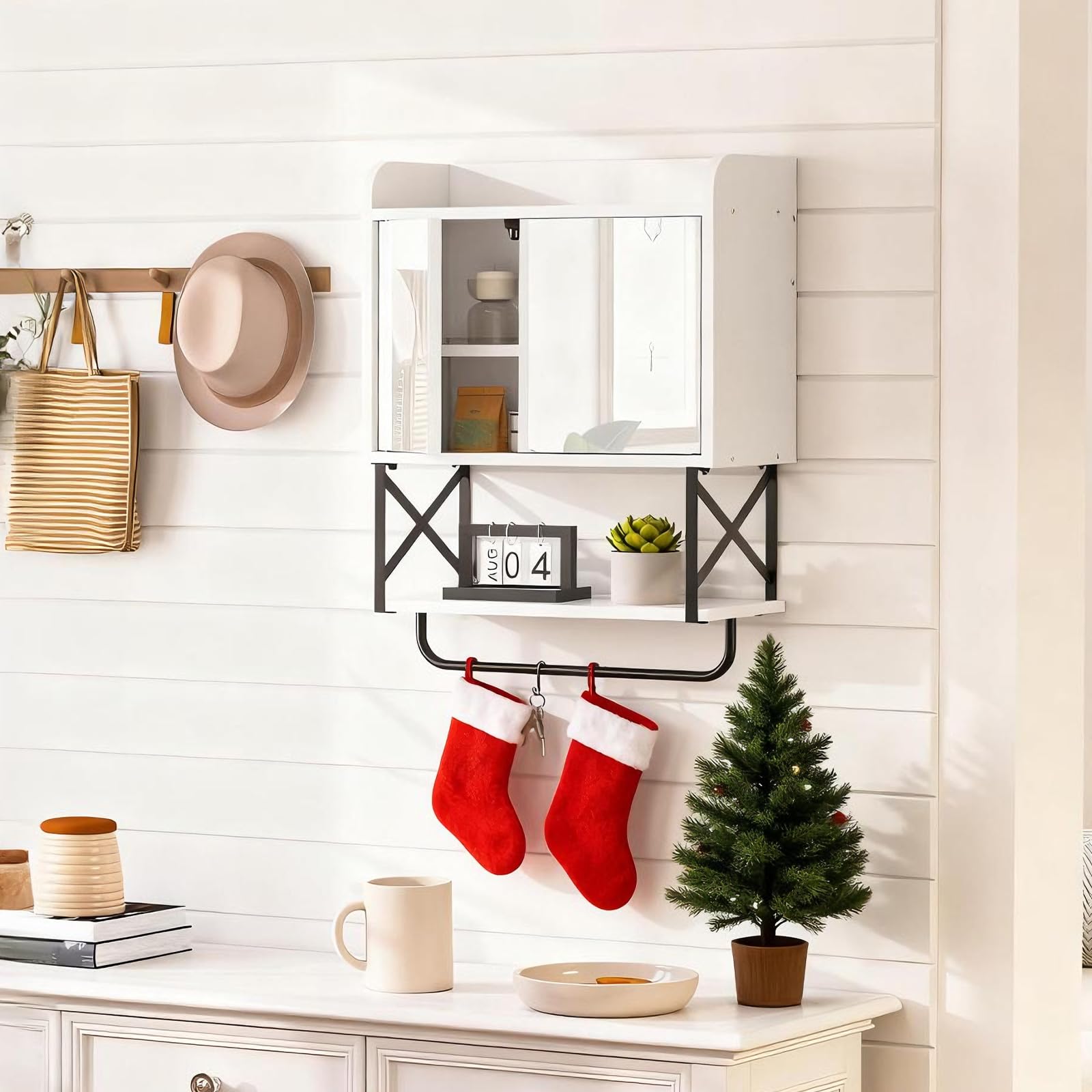 Decorative wall shelf with stockings, small Christmas tree, and festive decor in a home setting.