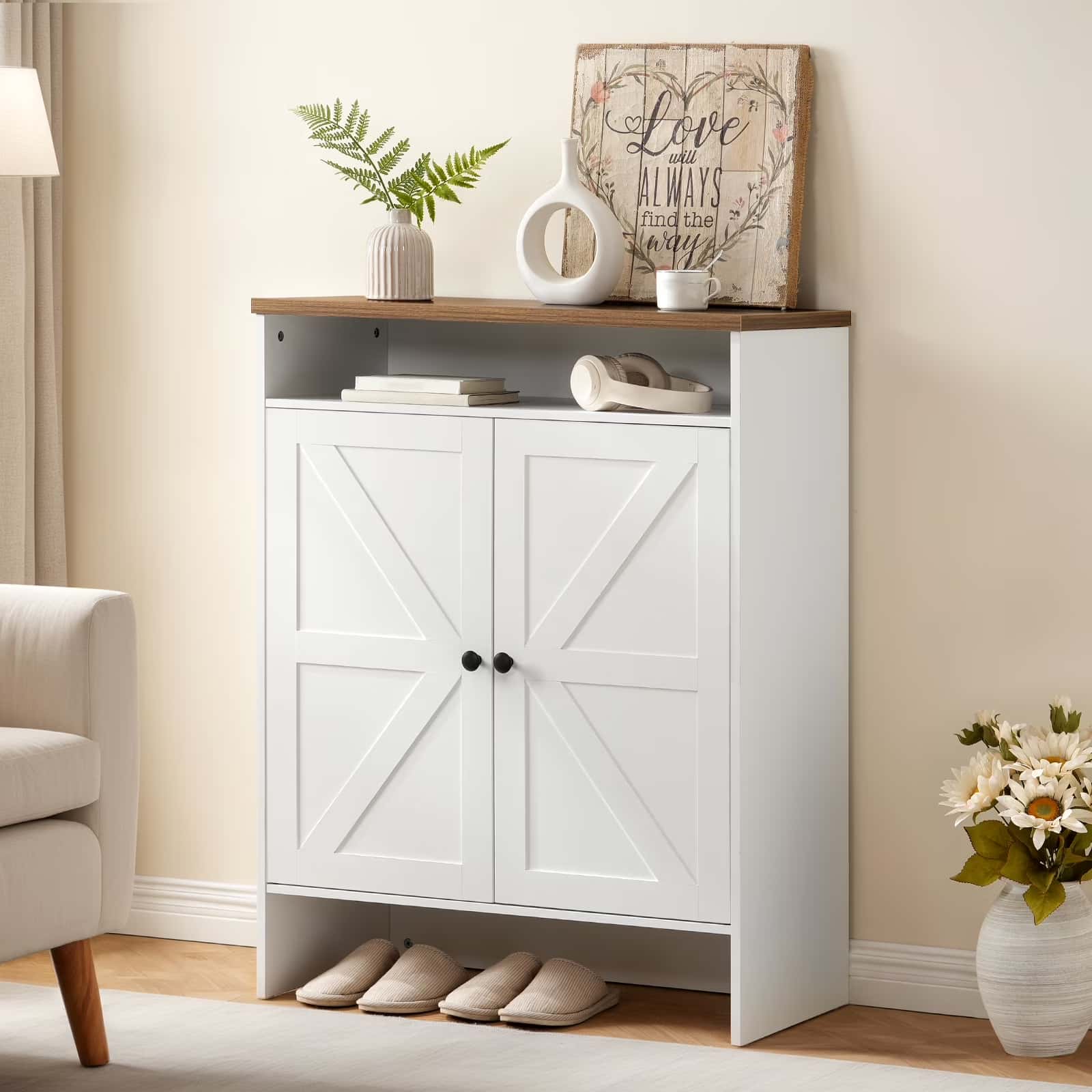 White storage cabinet with wooden top in a room setting with decor items.