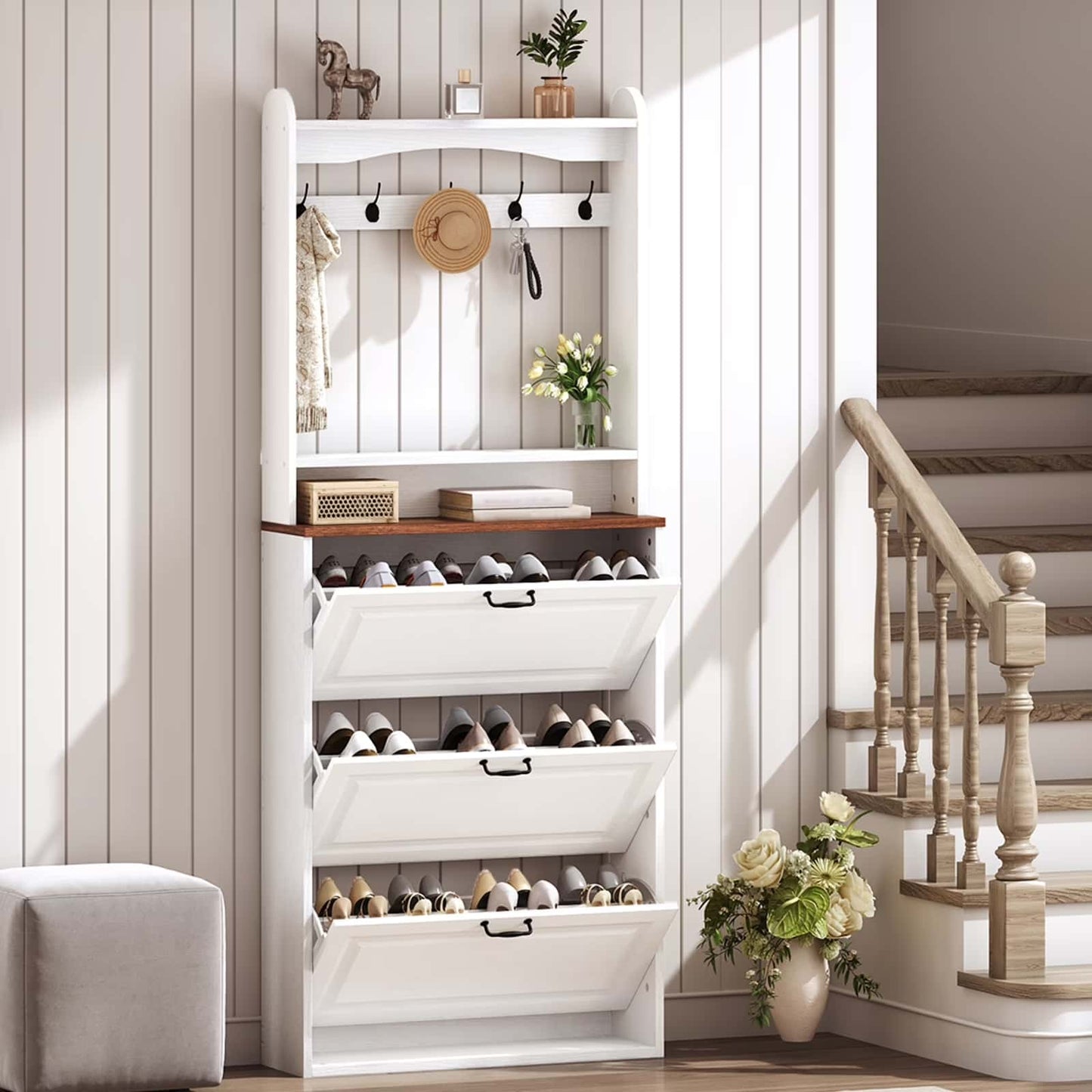 White shoe rack with multiple shelves and drawers in a home setting.