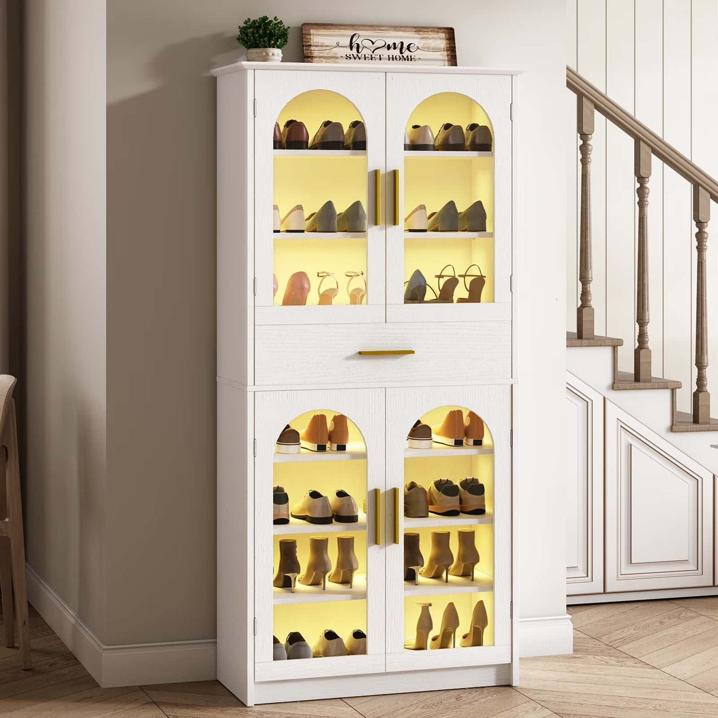 White shoe cabinet with glass doors displaying shoes in a home setting.