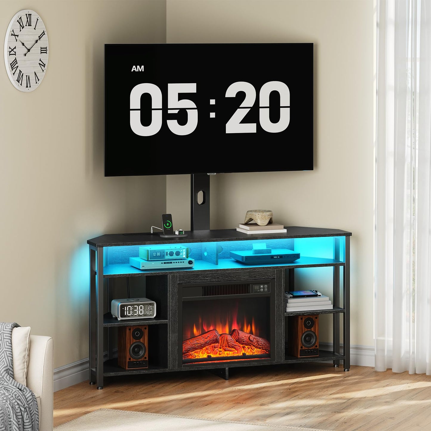 Modern entertainment console with electric fireplace, TV, and digital clock in a living room setting.