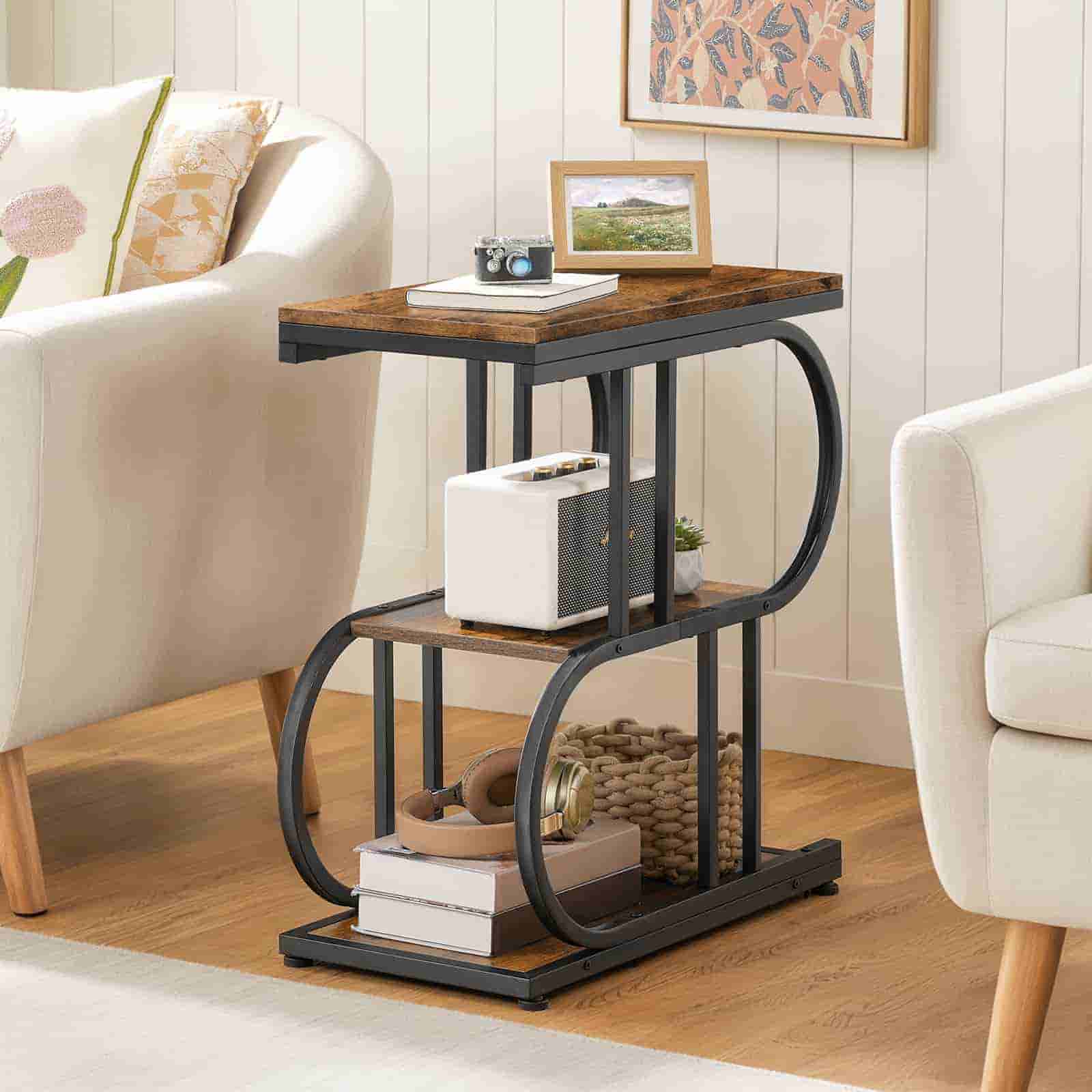 Three-tiered side table with wooden top and metal frame in a living room setting.
