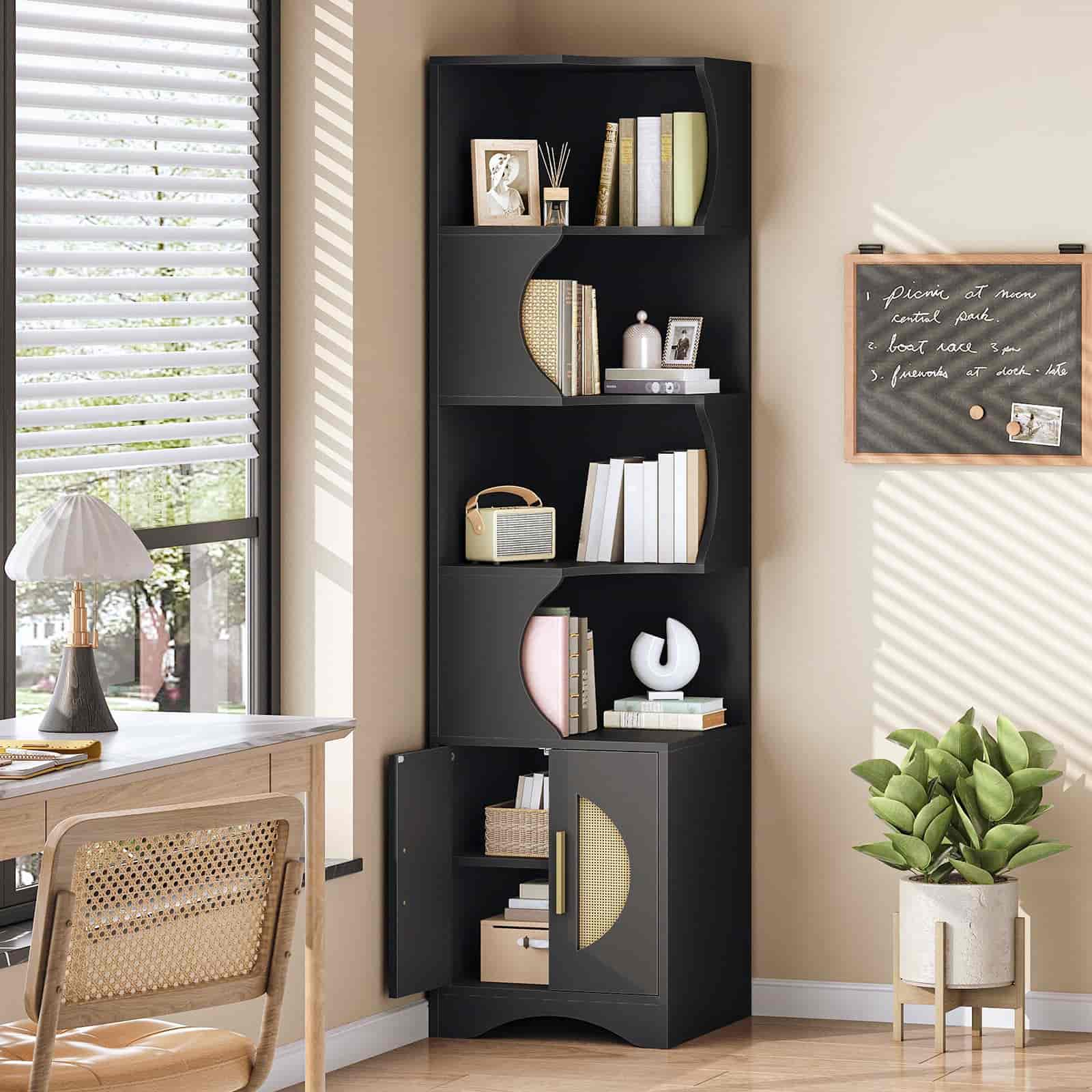 Black bookshelf with decorative items in a room with a desk and window.