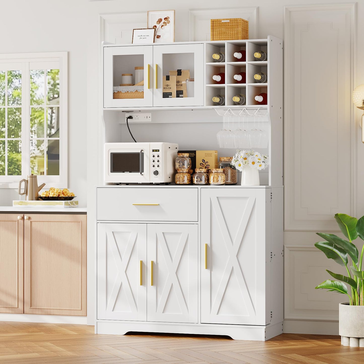 White kitchen cabinet with microwave and appliances in a bright kitchen.