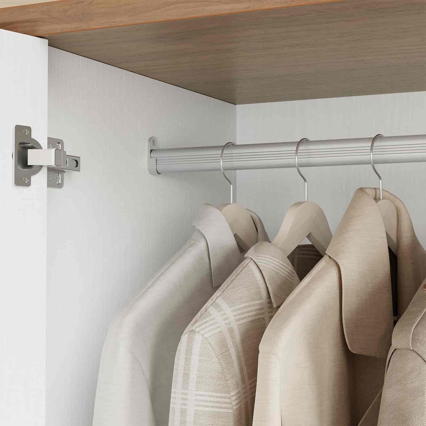 Clothing items on hangers in a closet with a wooden shelf above.