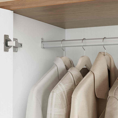 Clothing items on hangers in a closet with a wooden shelf above.