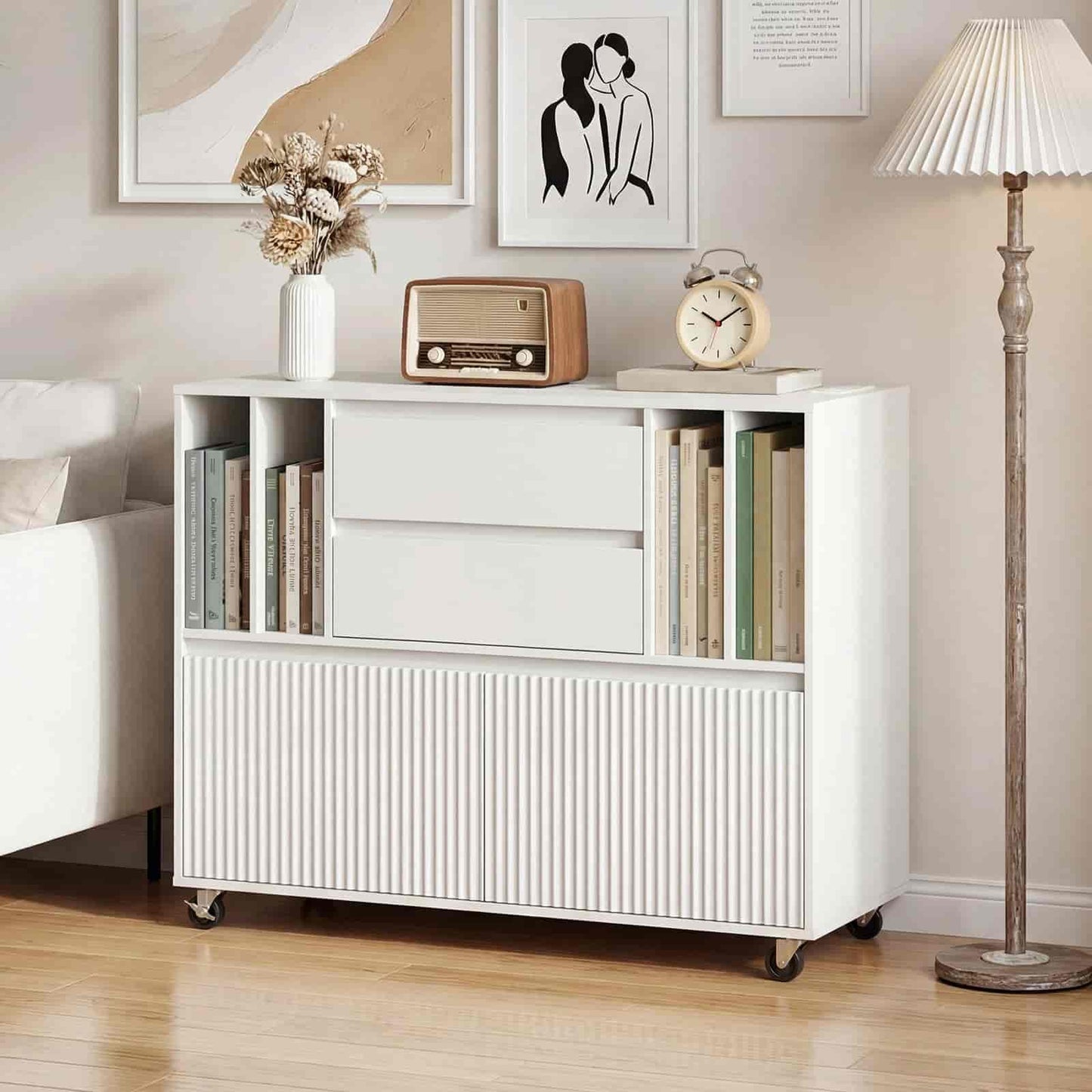 White storage cabinet with books and decorative items in a room setting