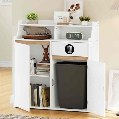 White storage unit with a trash can inside, books, and decorative items on a wooden floor.
