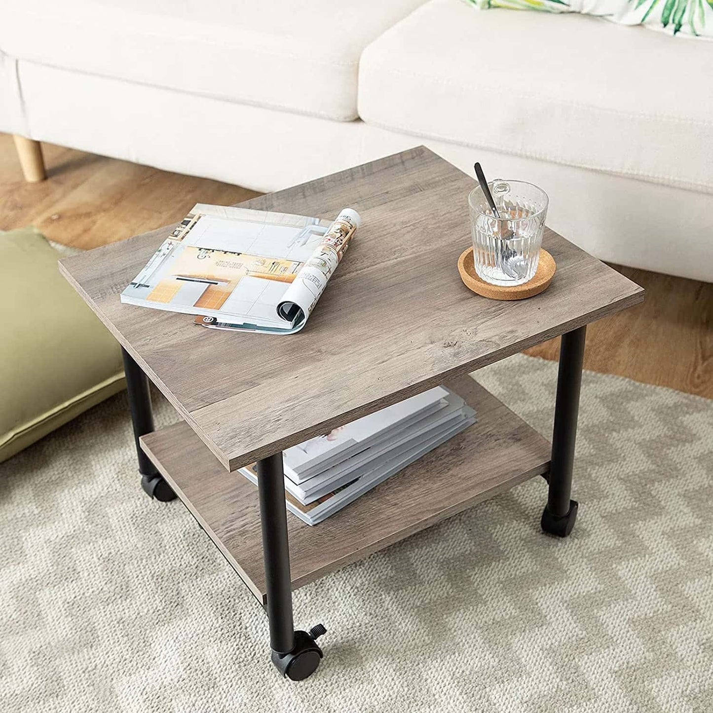 Coffee table with a magazine and glass in a living room setting