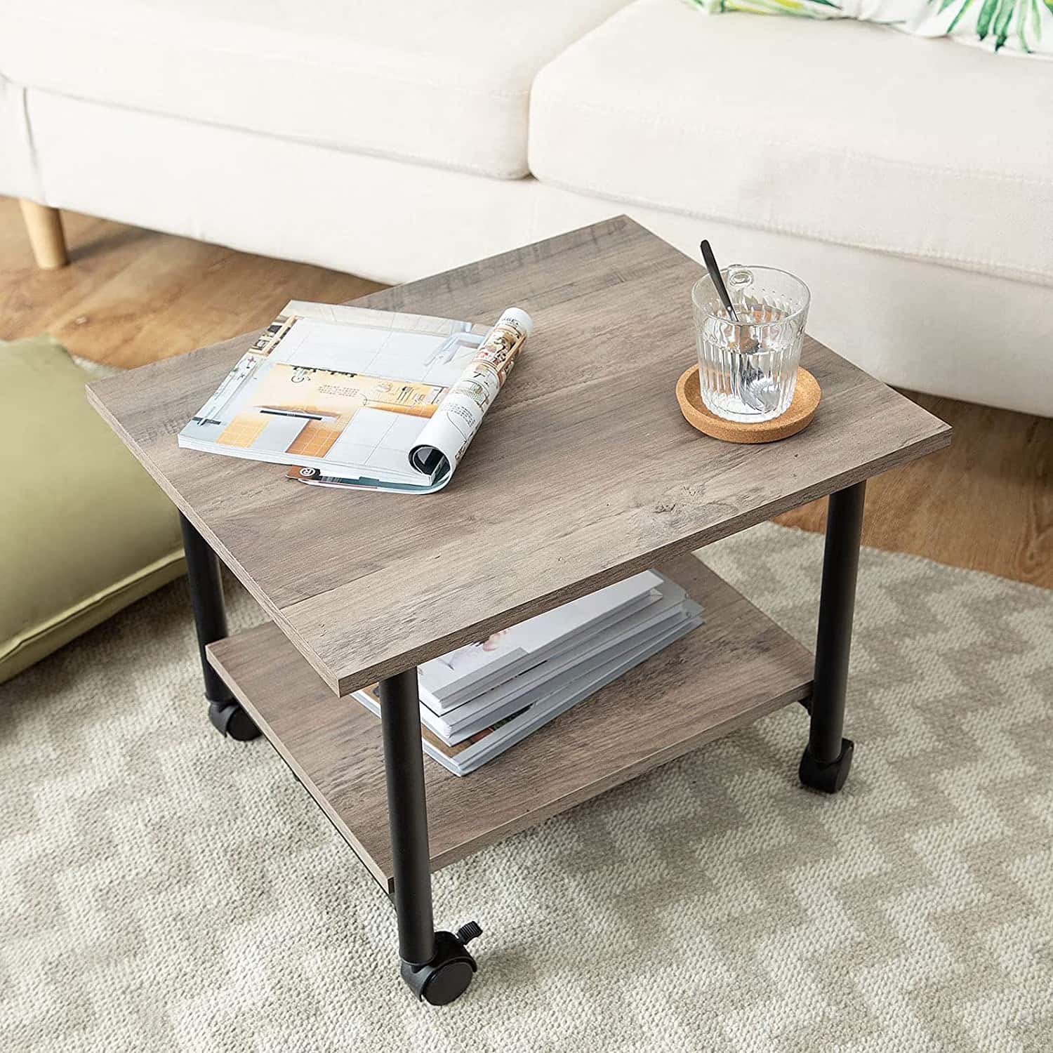 Coffee table with a magazine and glass in a living room setting