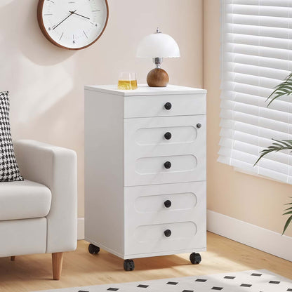 White dresser with drawers in a room with a clock, lamp, and plant.