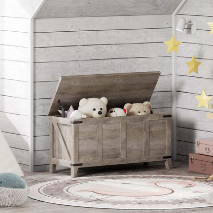 Wooden toy chest with stuffed animals in a child's room with wooden walls and star decorations.