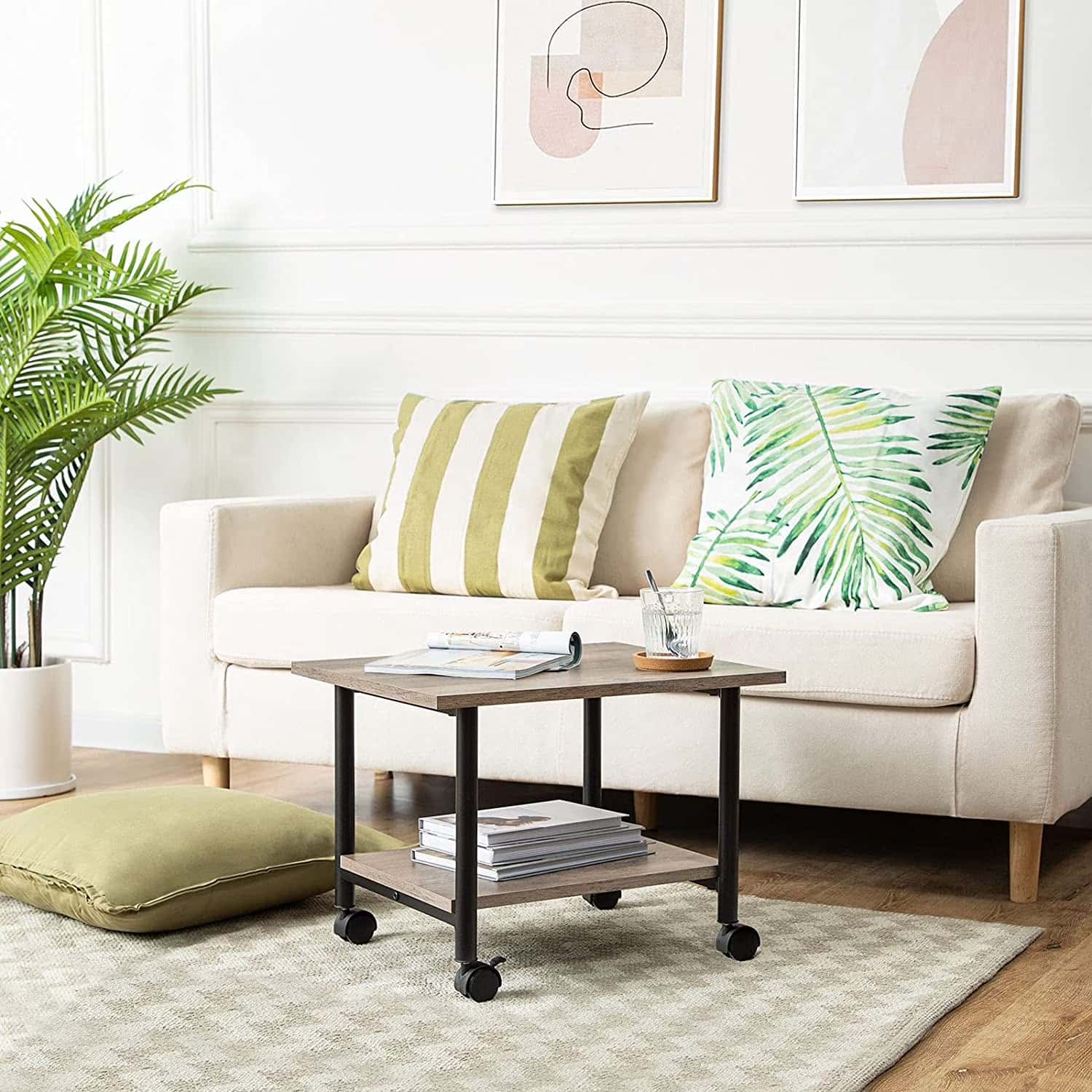 Modern living room with a beige sofa, decorative pillows, and a coffee table.