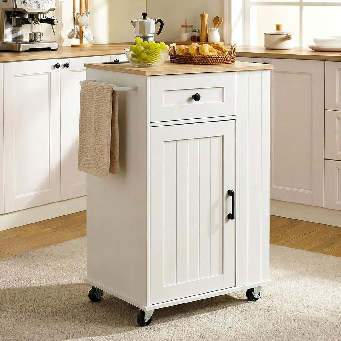 White kitchen island with a wooden top in a bright kitchen setting