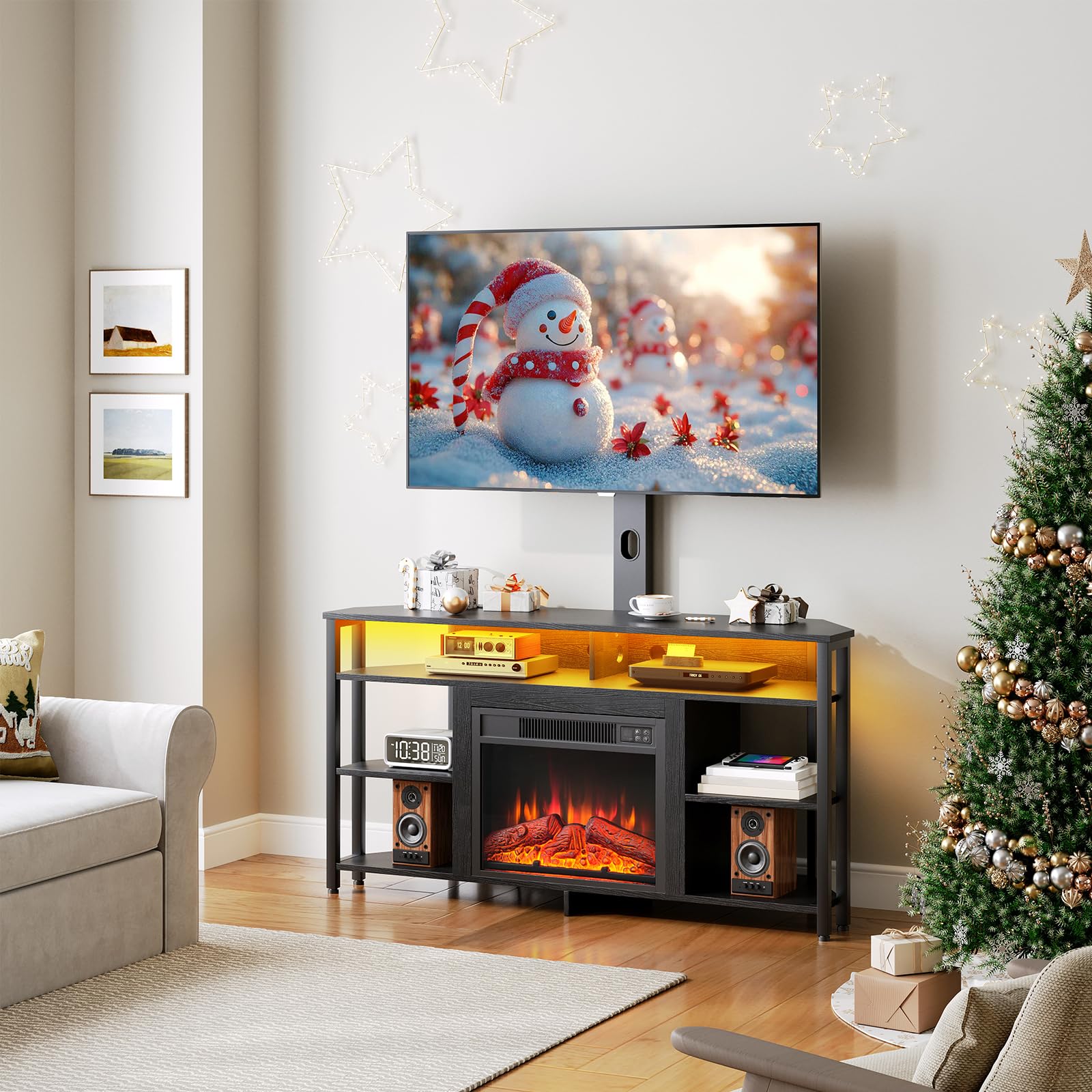 Living room with a TV displaying a snowman, a fireplace, and a Christmas tree.