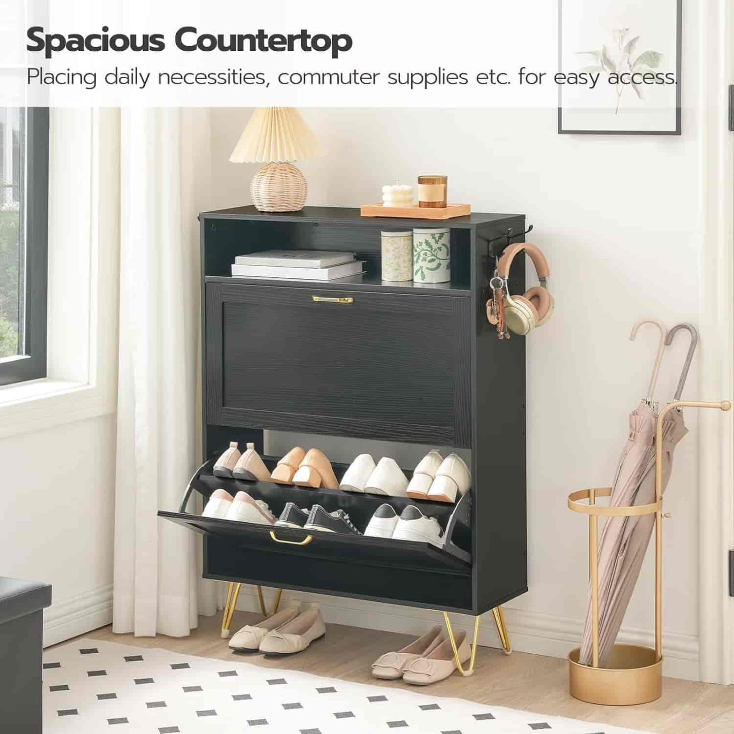 Black shoe cabinet with open drawer displaying shoes, placed in a room with a window and umbrella stand.