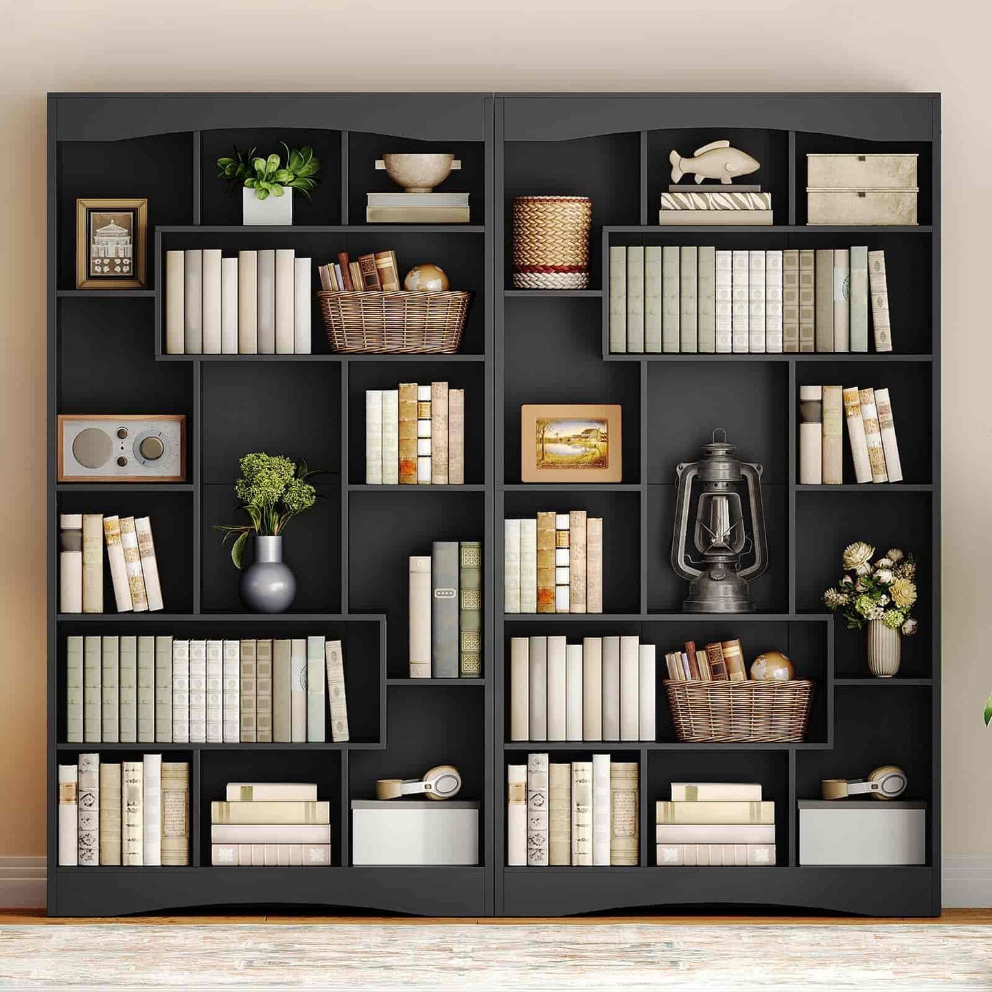 Black bookshelf with various decorative items against a beige wall