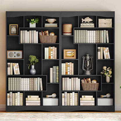 Black bookshelf with various decorative items against a beige wall