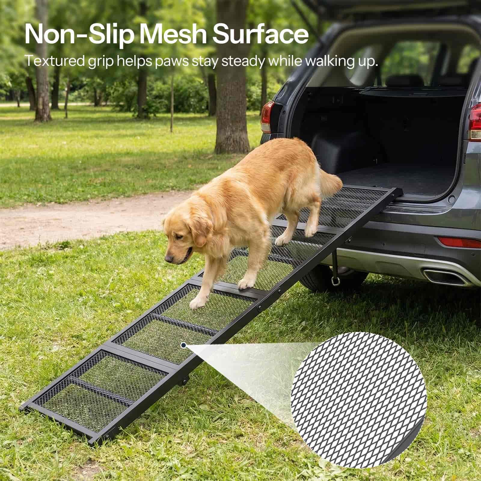 Dog using a non-slip mesh surface ramp to get into an open car trunk in a park.