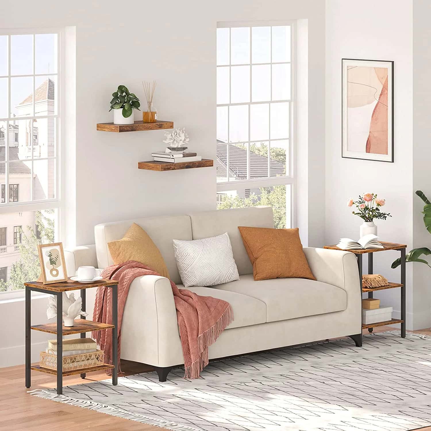 Living room with a beige sofa, decorative pillows, and side tables.