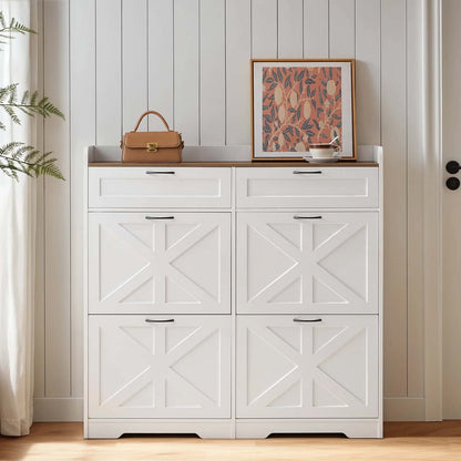 White shoe cabinet with decorative items on top against a wooden wall.