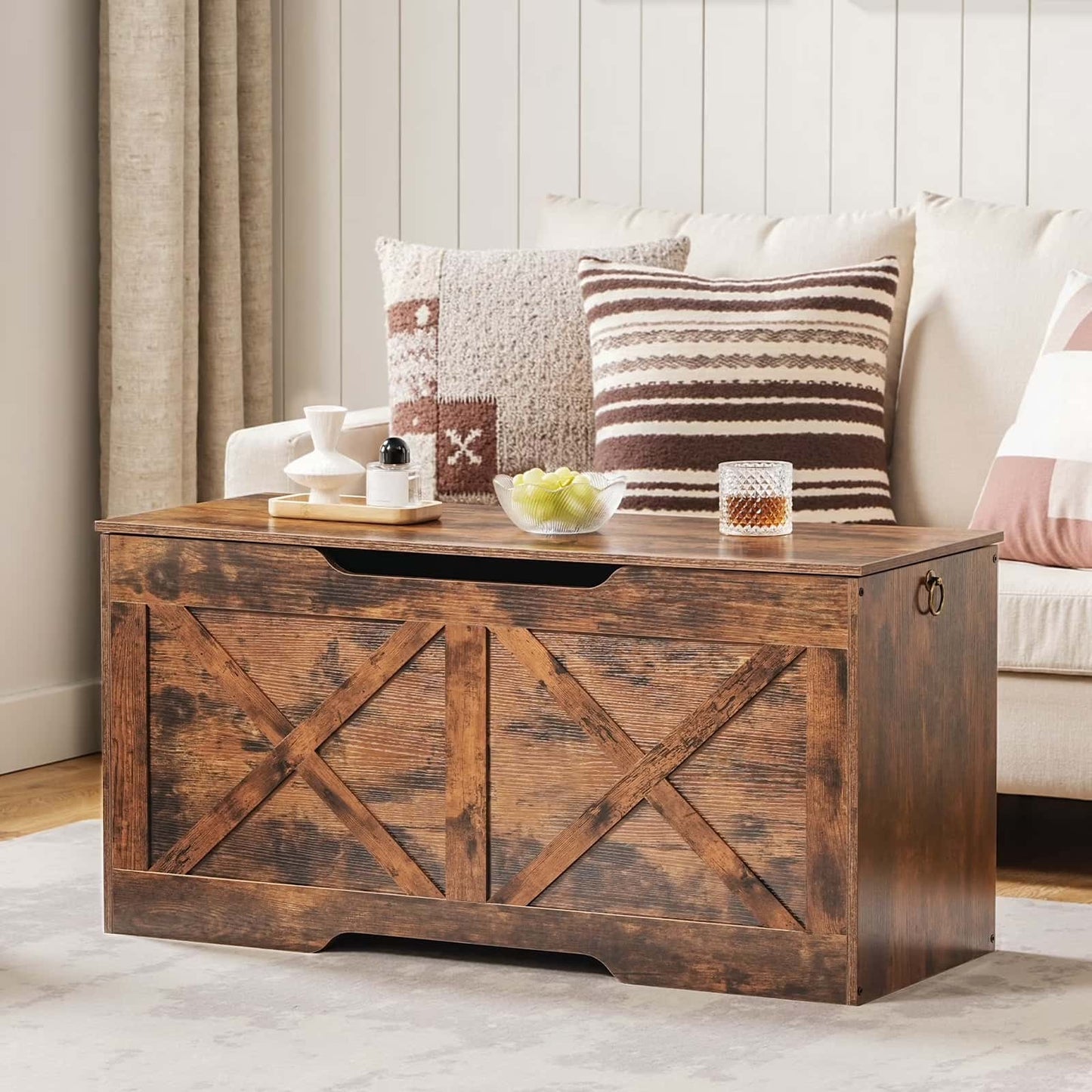 Wooden coffee table with decorative items in a living room setting