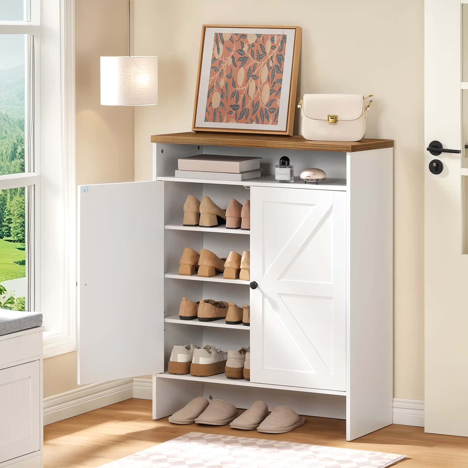 White shoe cabinet with wooden top in a room with a window and decor items.