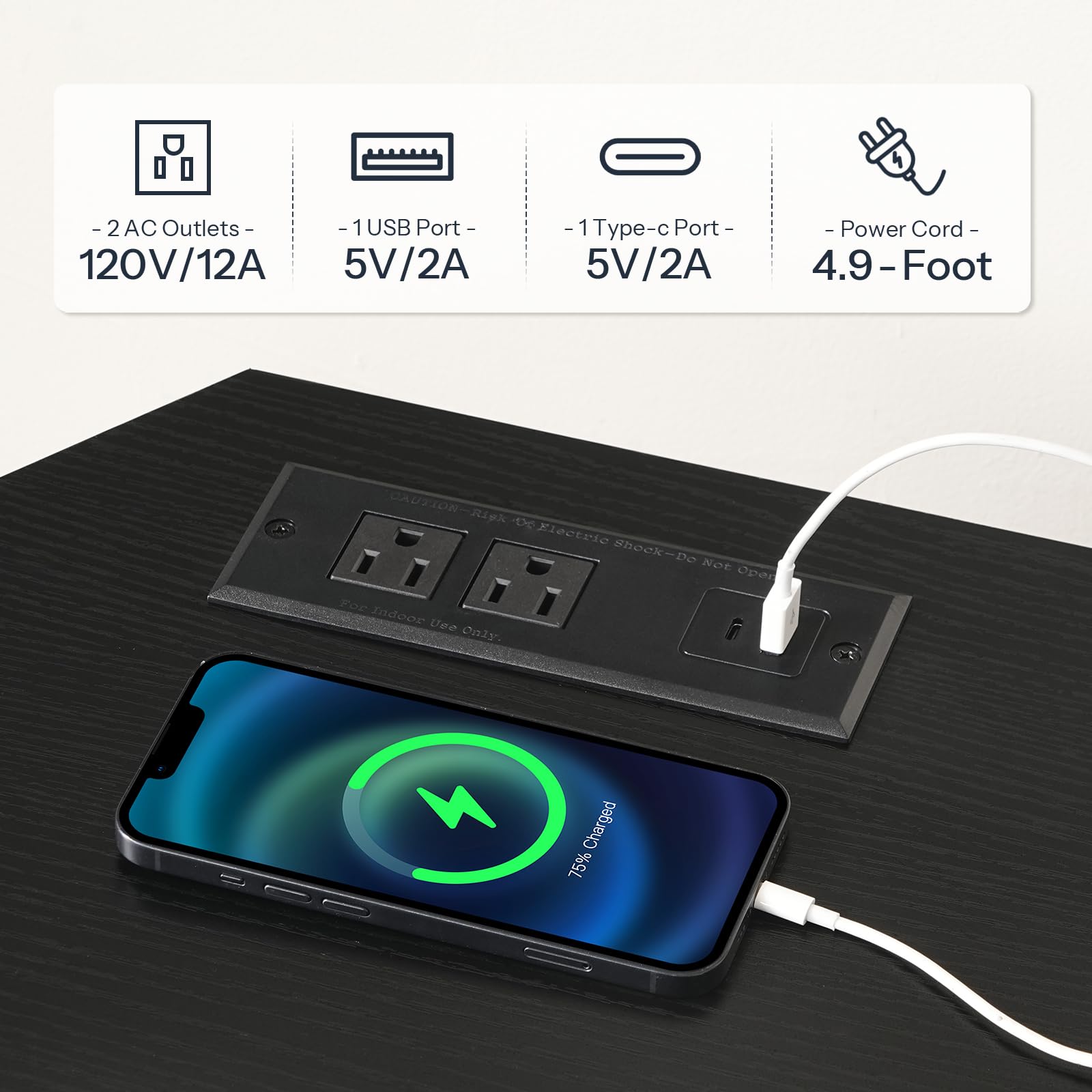 Power outlet with multiple ports and a smartphone being charged on a black surface.