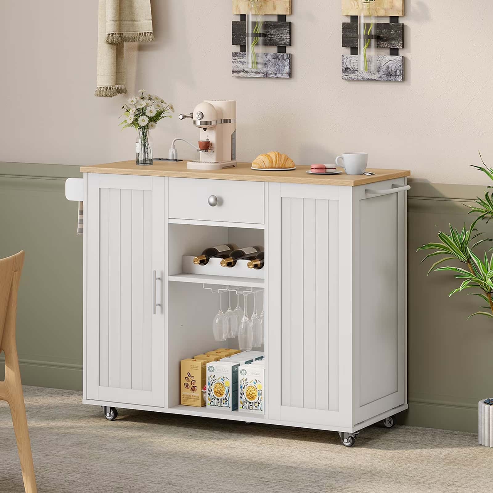 Kitchen island with wooden top and storage cabinets in a kitchen setting.