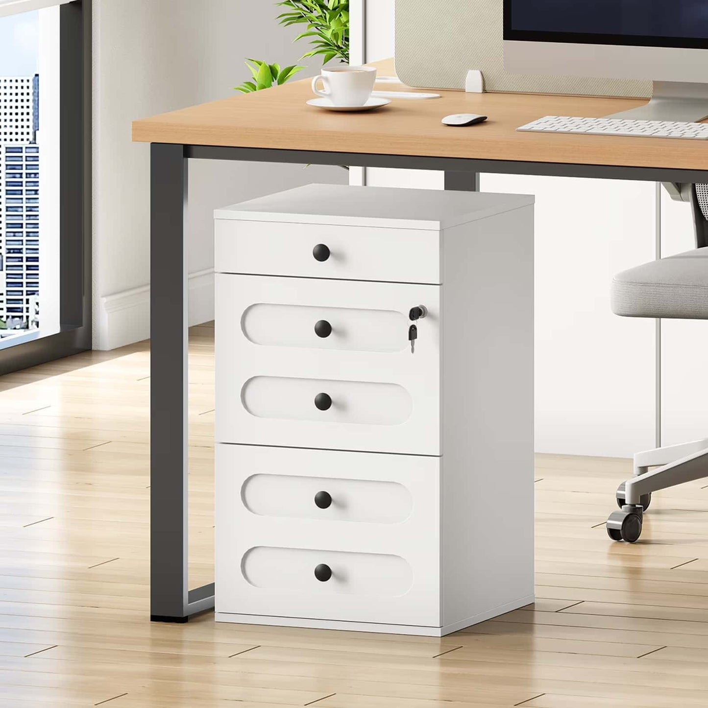 White filing cabinet next to a wooden desk with a computer setup in an office.