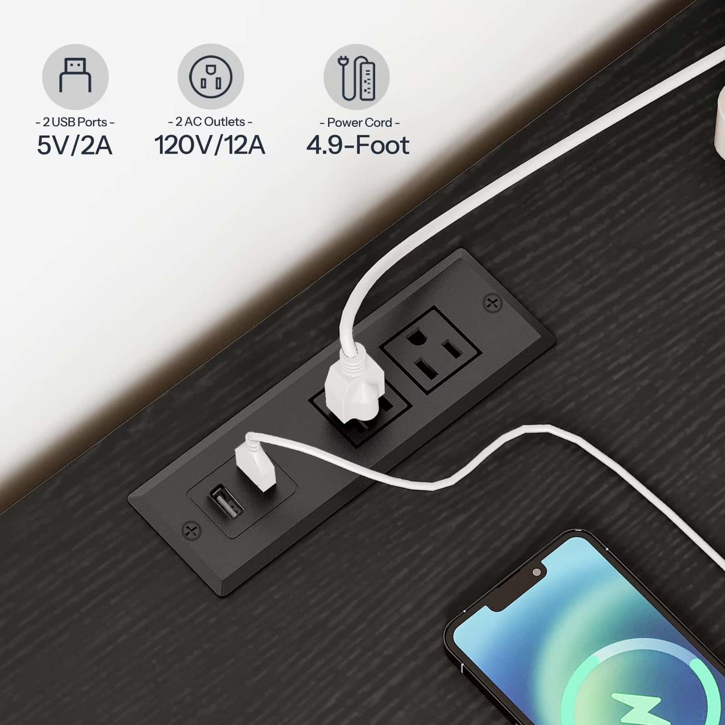 Power strip with multiple outlets and ports on a desk with a smartphone plugged in.