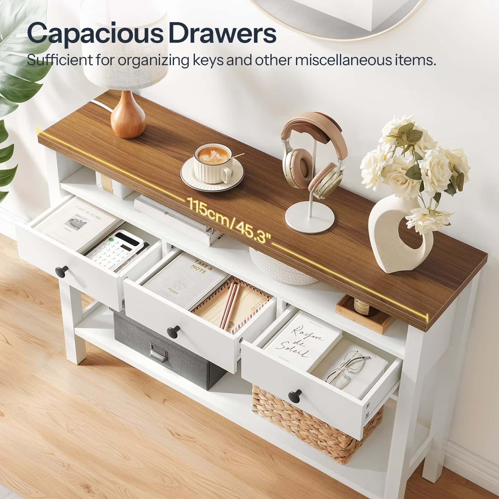 White console table with wooden top and drawers, used for organizing keys and other items.