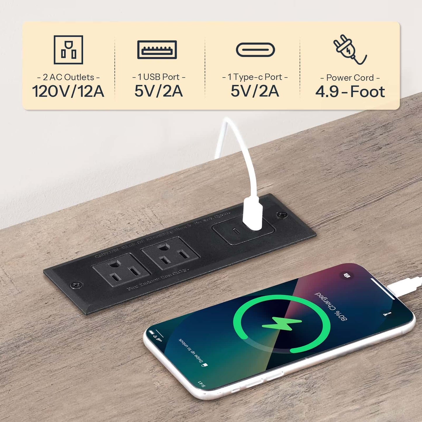 Black power strip with multiple outlets and ports on a wooden surface, with a smartphone charging.