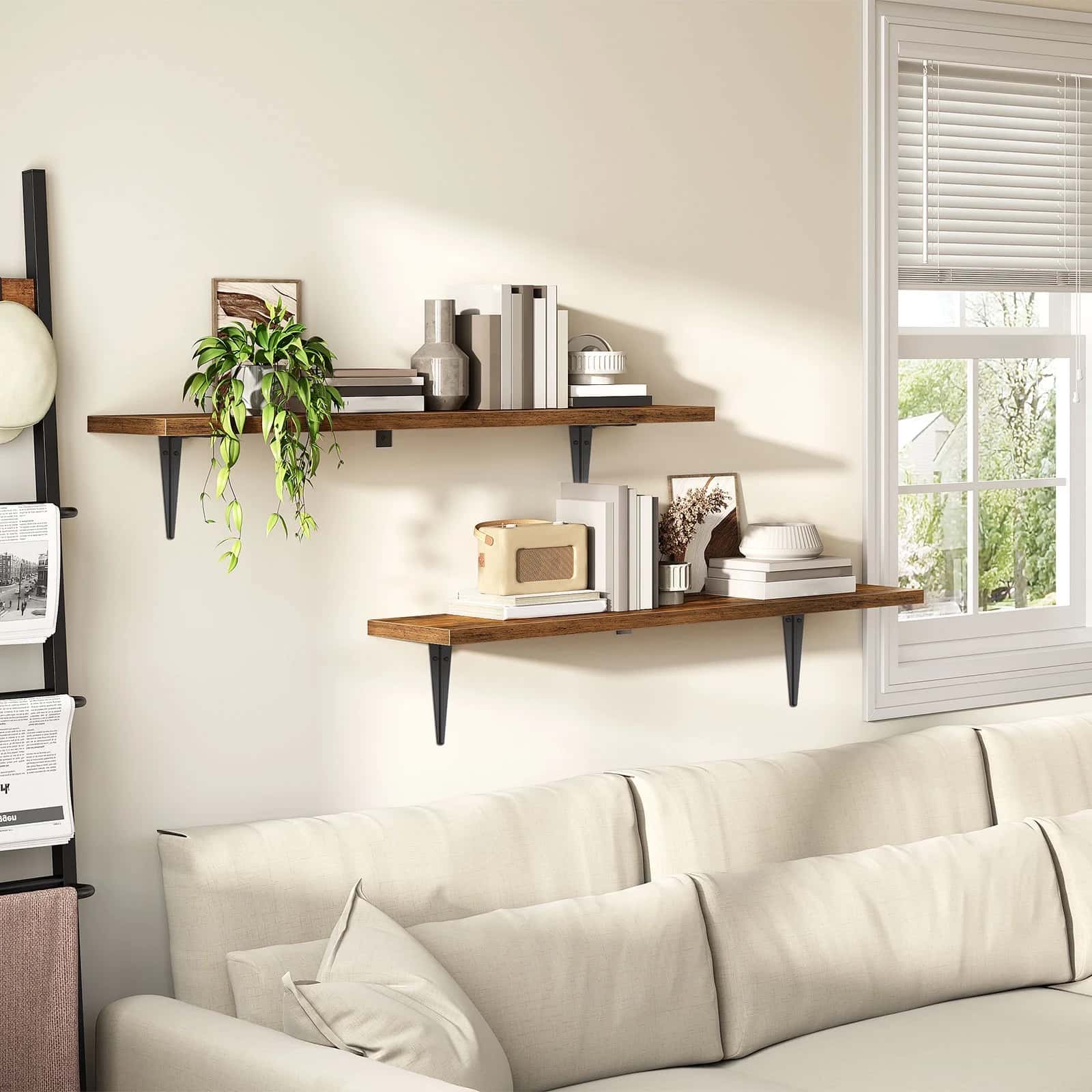 Living room with a beige sofa, wooden shelves, and decorative items.