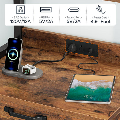 Desk setup with charging station, phone, watch, and tablet on a wooden surface.