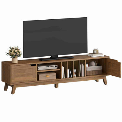 Wooden TV stand with a television on top, featuring shelves and decorative items.