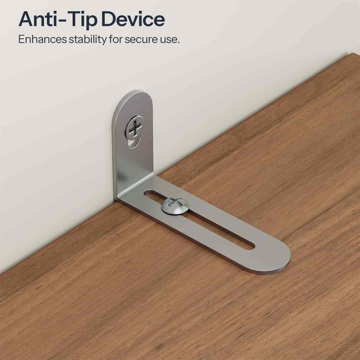 Anti-tip device on a wooden surface with text indicating its function.