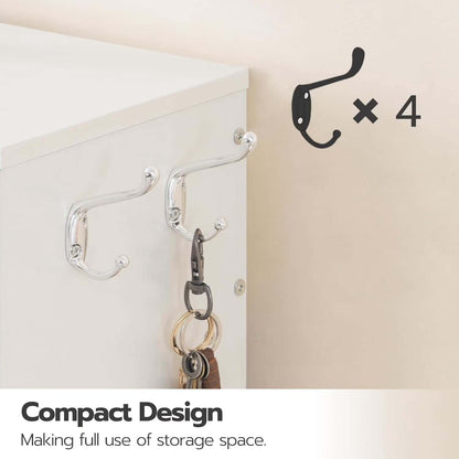 Set of four wall hooks on a white surface with keys hanging from one of them, labeled 'Compact Design'.