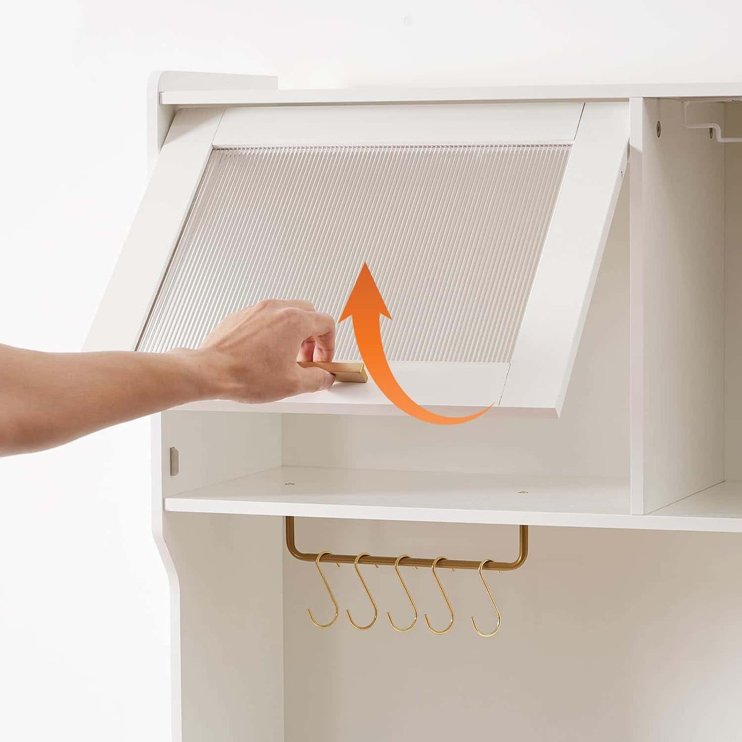 Hand opening a white cabinet door with an orange arrow pointing upwards, showing the interior.