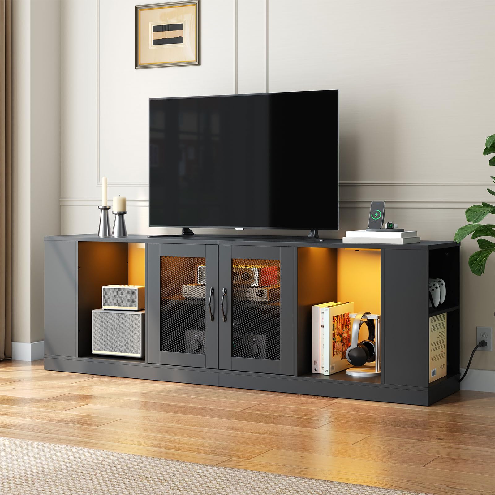 Modern TV stand with a television mounted on it in a living room setting.