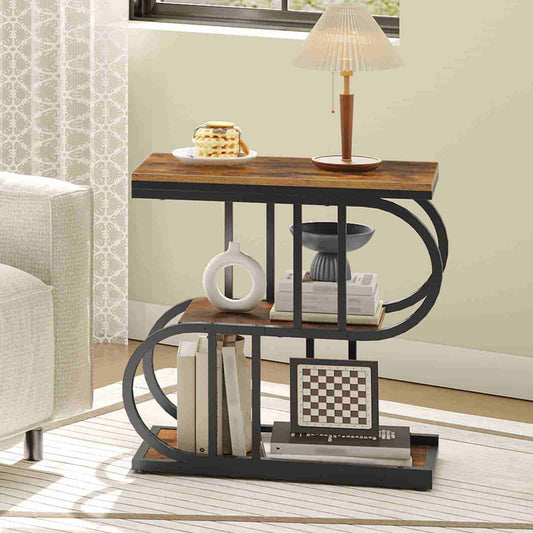 Three-tiered side table with books, a vase, and a chessboard in a living room setting.